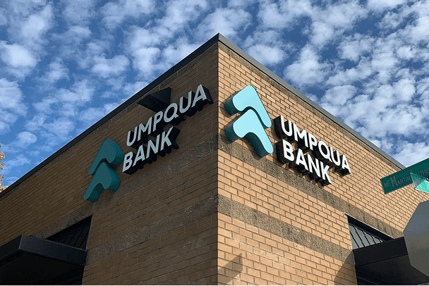 UMPQUA Bank sign on top corner of brick building.